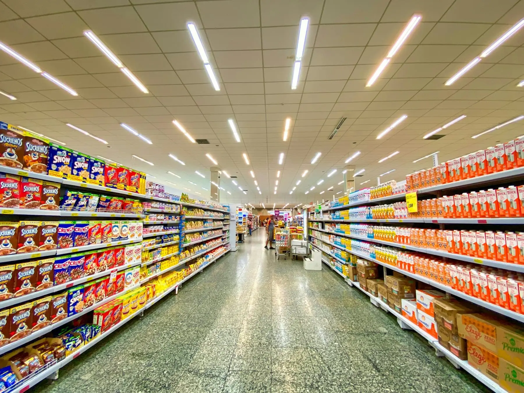 Grocery store aisle with stocked shelves