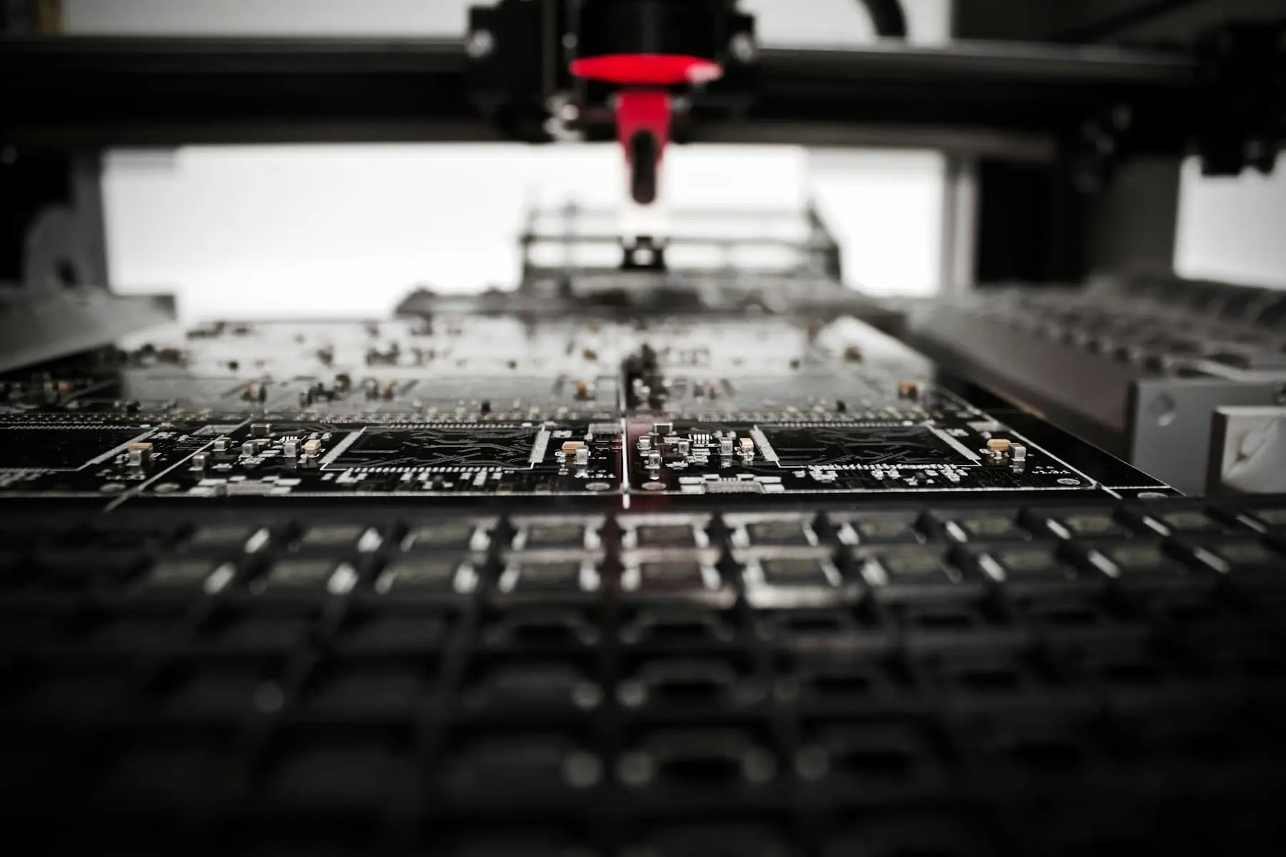 Robotic arm working above a circuit board